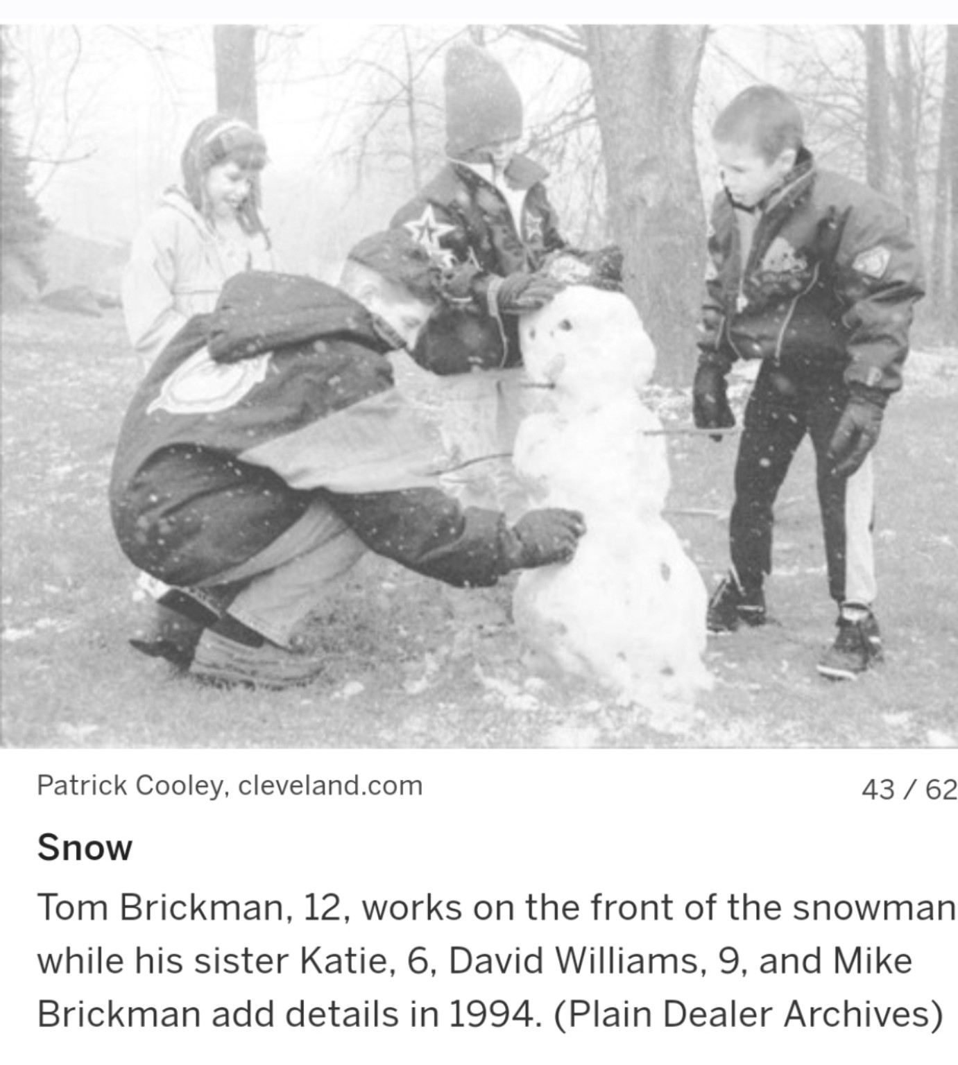 1994 Plain Dealer archive photo of Tom, Katie, Mike, and David building a snowman